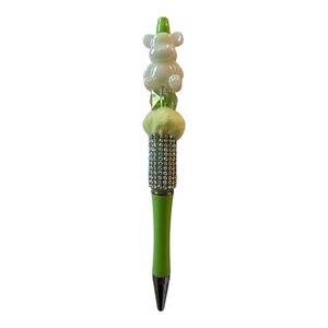 Green and White Decorative Pen
